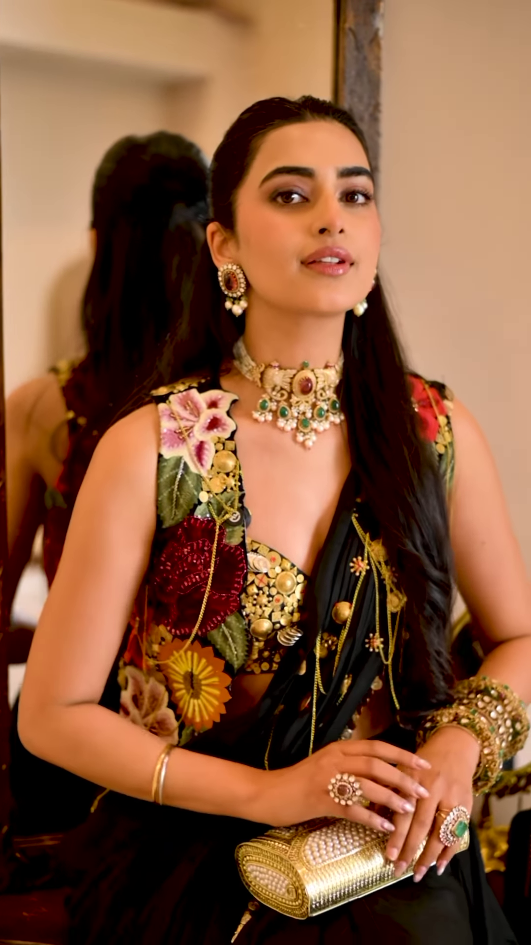 Women’s Black Saree with Gold Embellishments & Pleated Draping – Elegant Ethnicwear Styled with Traditional Bracelet