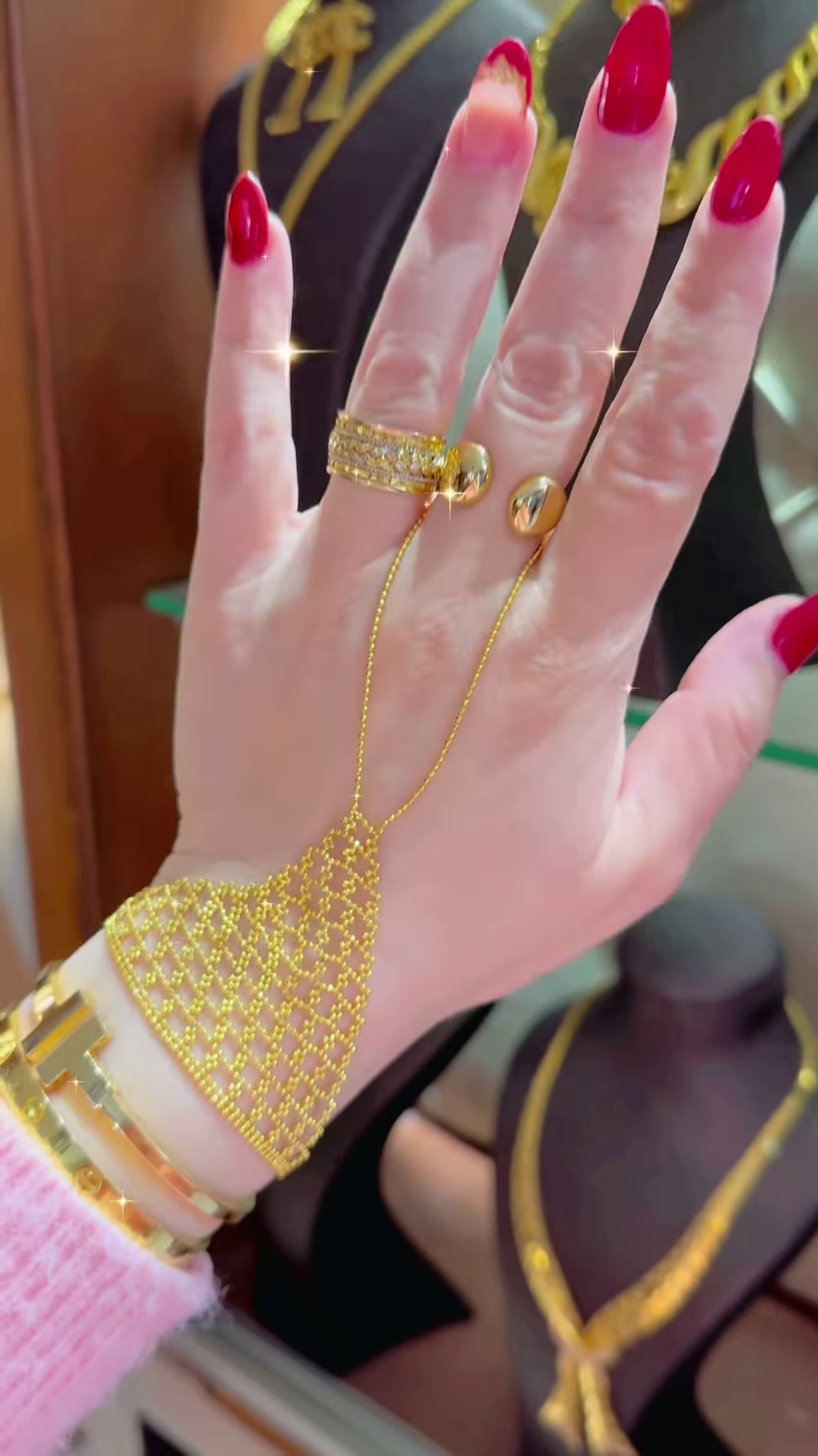 Ornate Gold-Toned Hand Chain Bracelet with Intricate Mesh and Ring Attachments