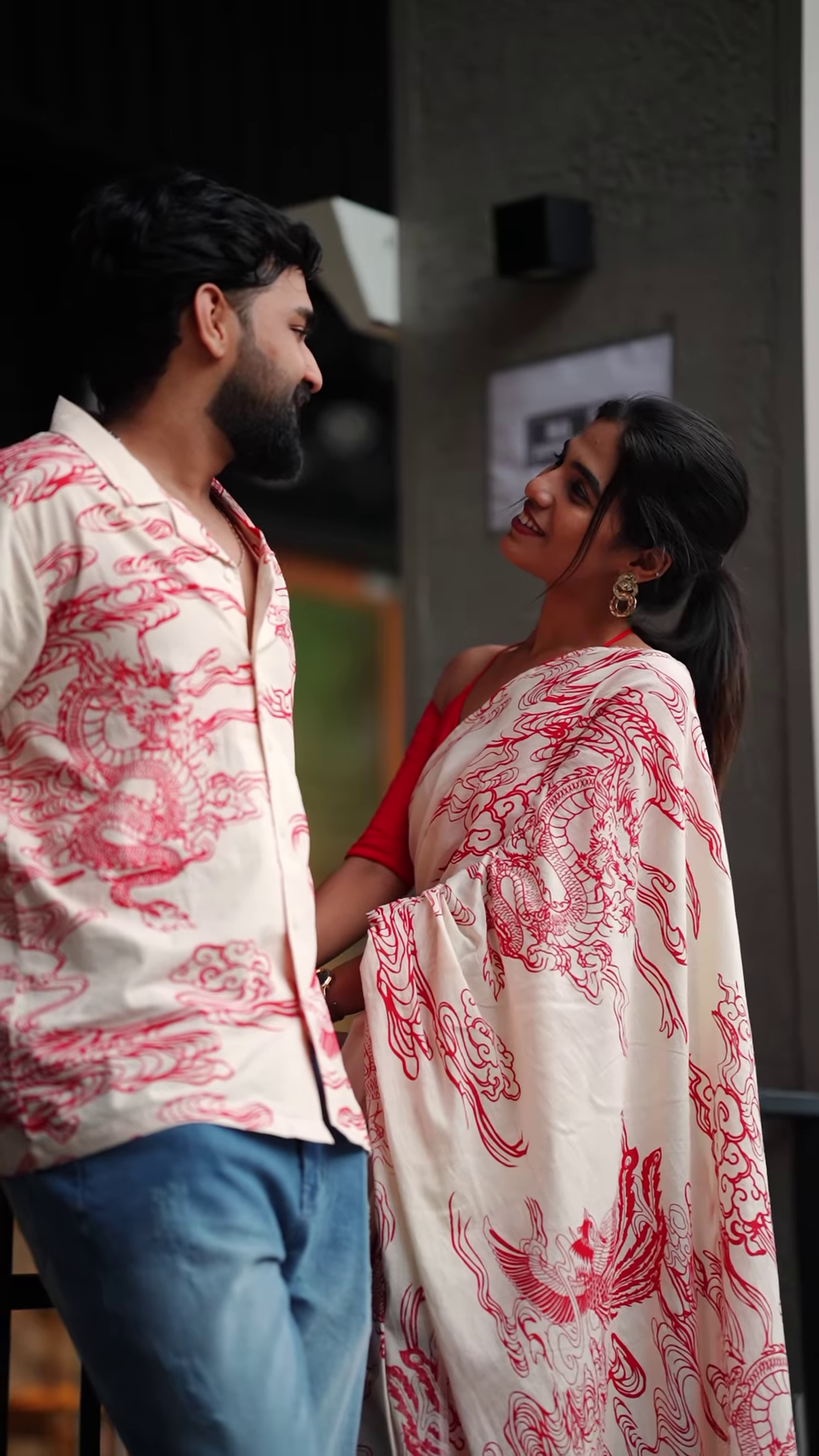 Couple’s Coordinated Ethnic Ensemble – White & Red Printed Saree with Matching Shirt and Jeans