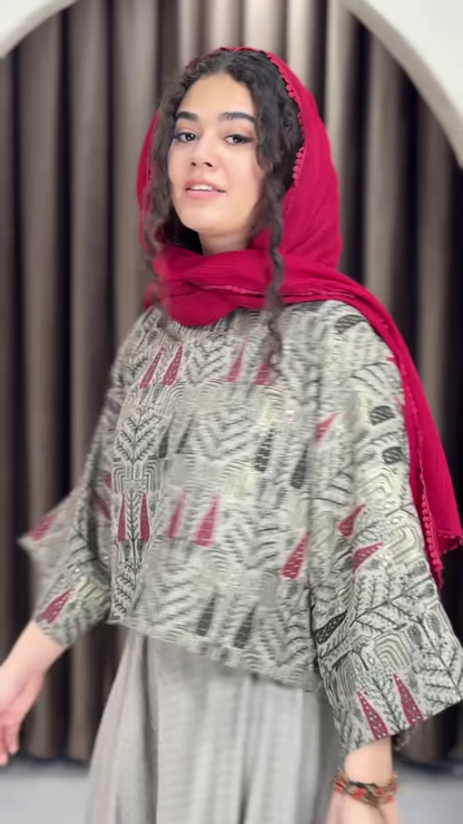 Women’s Red Printed Headscarf with Abstract Top & Gray Wide-Leg Pants – Boho Urban Doorway Portrait Ensemble