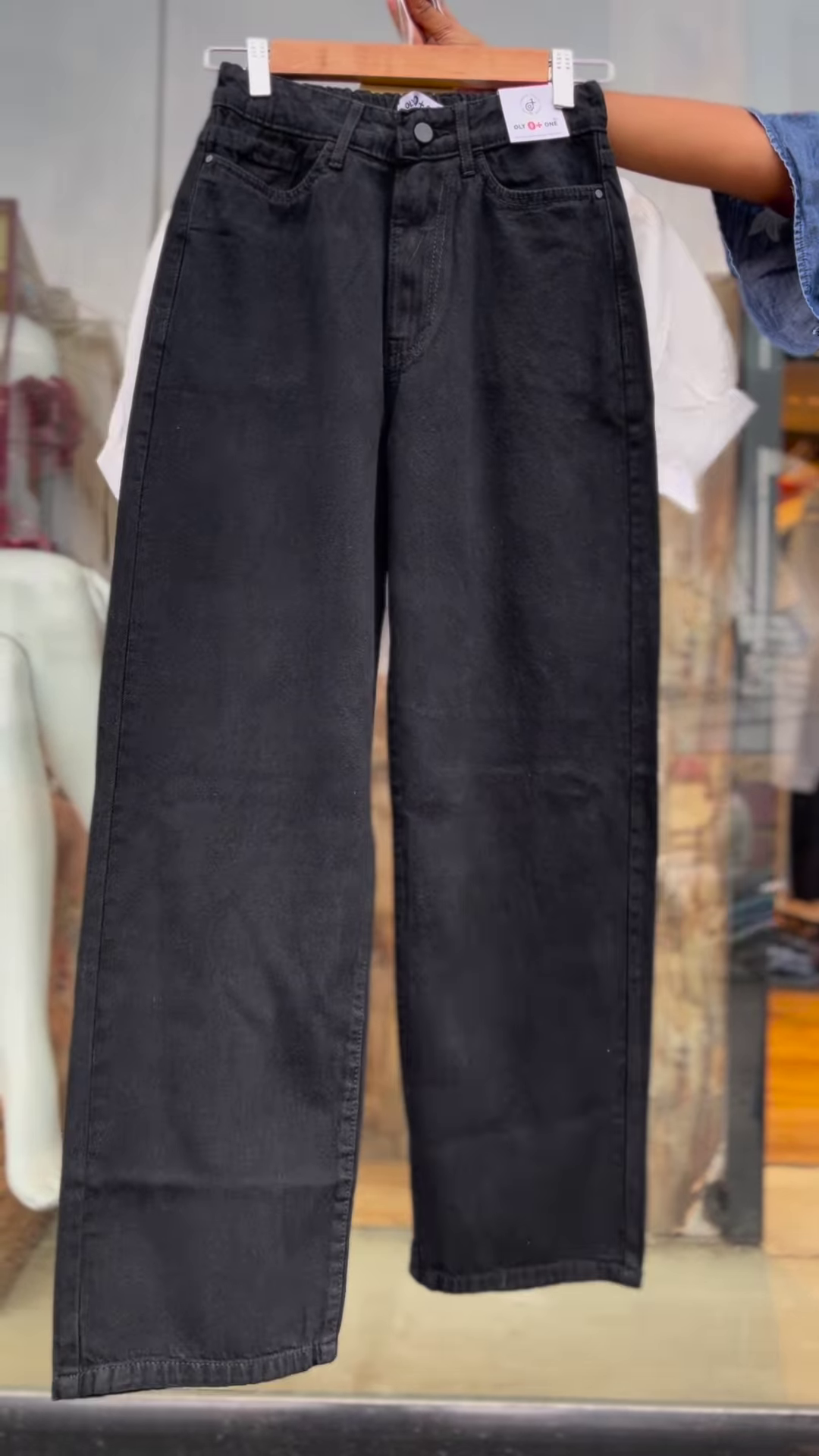 Women’s White Buttoned Crop Jacket with Striped Inner Top and Black Pants – Layered Streetwear Ensemble