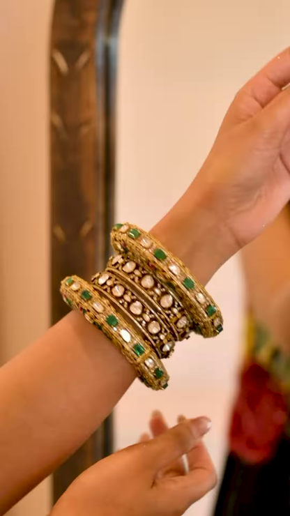 Women’s Black Saree with Gold Embellishments & Pleated Draping – Elegant Ethnicwear Styled with Traditional Bracelet