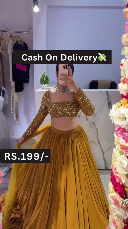 Golden Embroidered Blouse with Mustard Pleated Lehenga – Breezy Festive Style with Floral Mirror Selfie Vibes