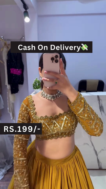Golden Embroidered Blouse with Mustard Pleated Lehenga – Breezy Festive Style with Floral Mirror Selfie Vibes