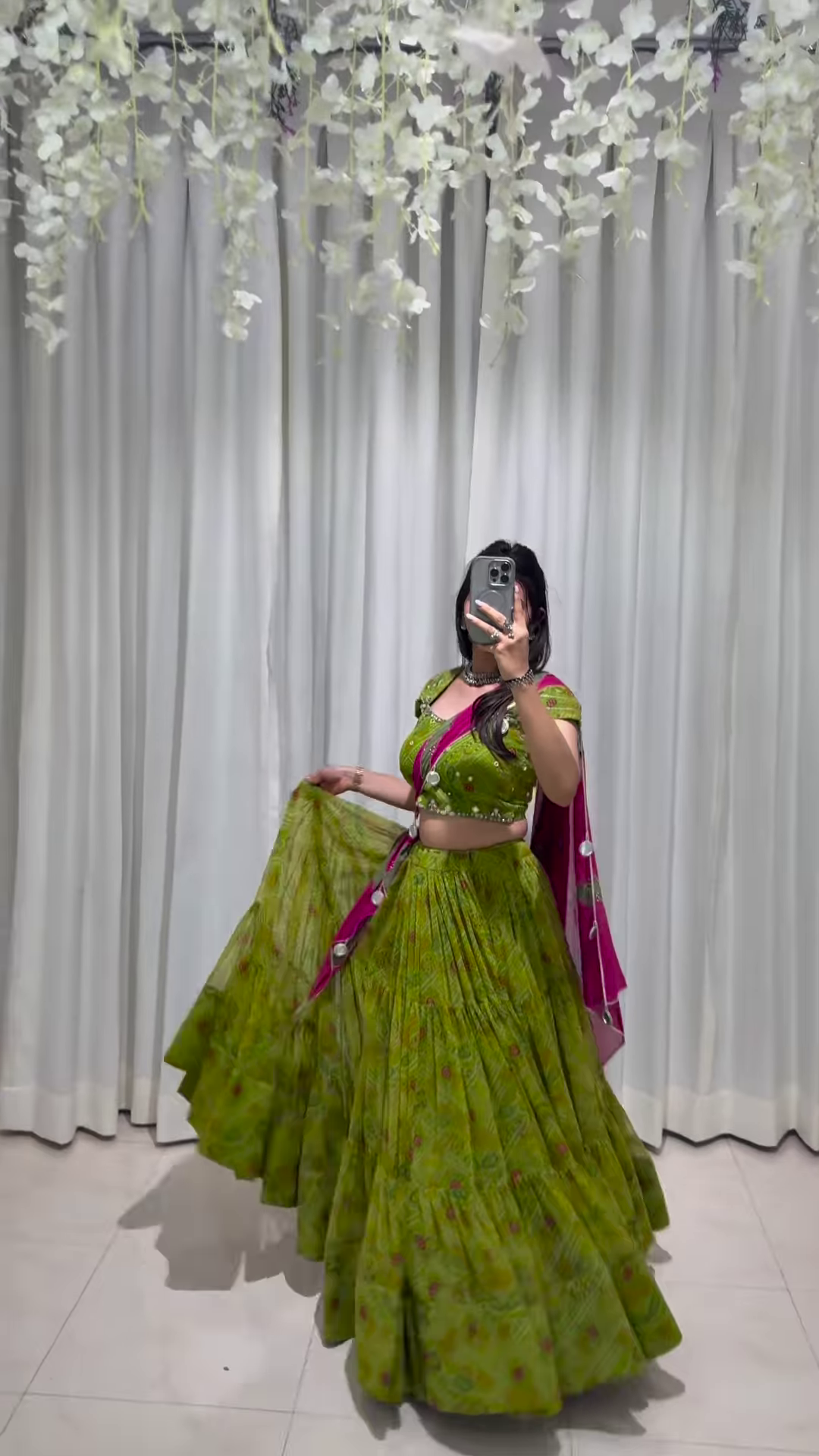 Graceful Green Lehenga Choli with Ornate Pink Dupatta – A Celebration of Elegance and Heritage