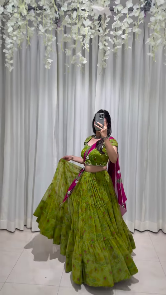 Graceful Green Lehenga Choli with Ornate Pink Dupatta – A Celebration of Elegance and Heritage