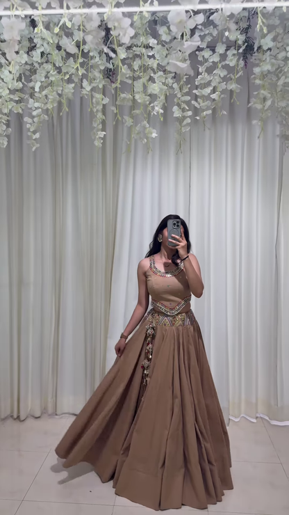 Brown Embroidered Lehenga Choli with Ornamental Tassel Detailing – A Classically Styled Look for Festive Grandeur