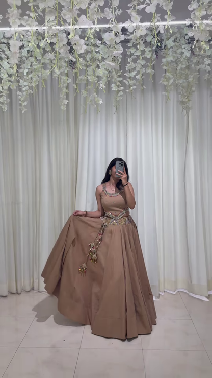 Brown Embroidered Lehenga Choli with Ornamental Tassel Detailing – A Classically Styled Look for Festive Grandeur