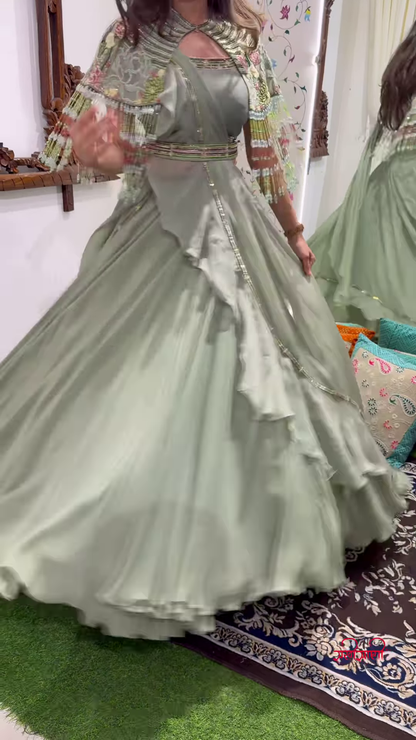 Light Green Cape-Style Lehenga Choli with Intricate Embellishments – A Boutique Favorite Blending Elegance and Modern Flow