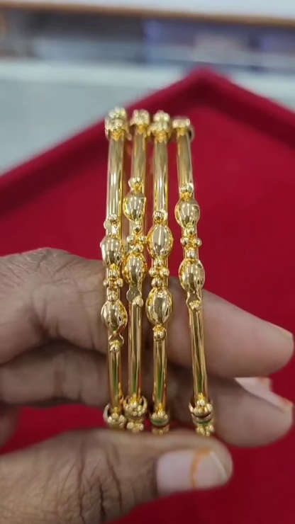Set of Four Traditional Gold-Plated Bangles with Enamel and Bead Accents