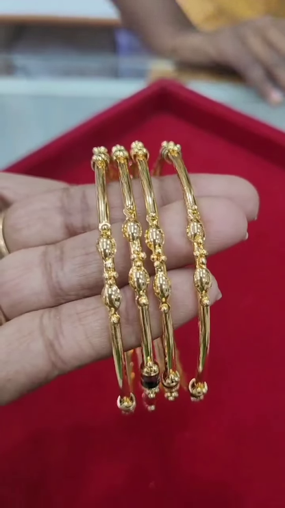 Set of Four Traditional Gold-Plated Bangles with Enamel and Bead Accents