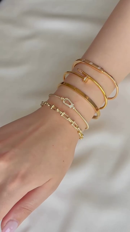 Layered Gold-Toned Bracelet Stack with Cartier Love Inspired Bangle and Knot Design