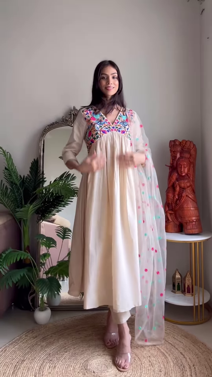 Cream Floral Kurta Set with Polka Dot Dupatta – Whimsical Elegance in a Boho Living Space