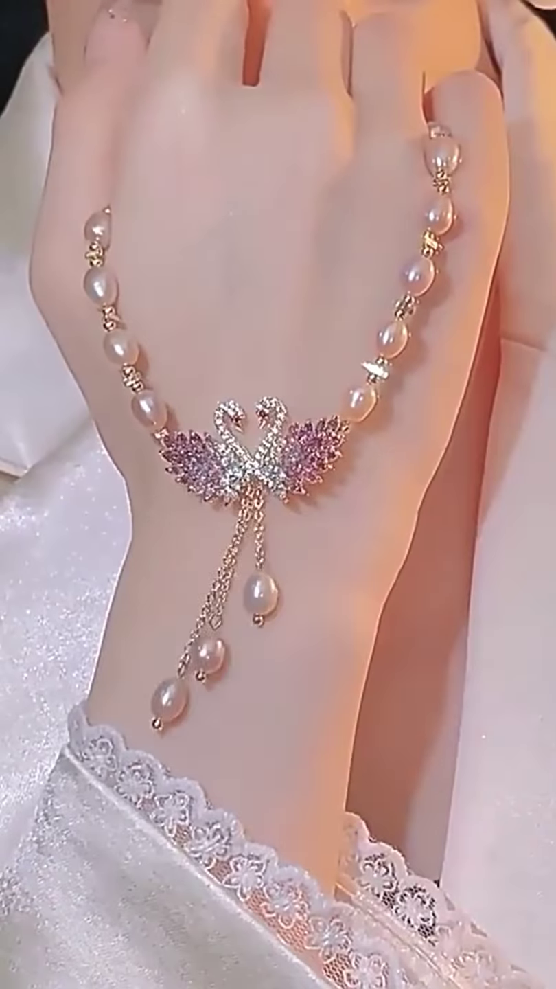 Elegant Pearl Necklace with Sparkling Swan Pendant and Gemstone Accents