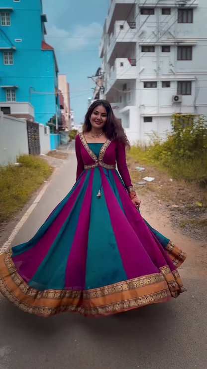 Elegant Teal & Magenta Sleeveless Anarkali Gown with Gold Zari Border