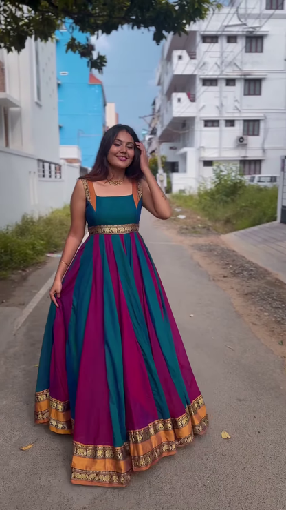 Elegant Teal & Magenta Sleeveless Anarkali Gown with Gold Zari Border