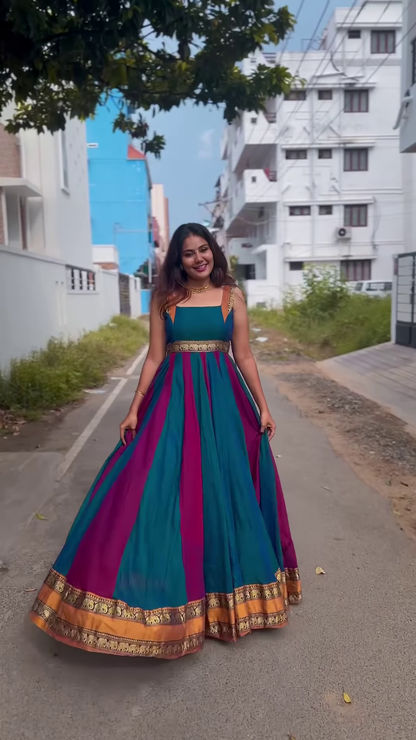 Elegant Teal & Magenta Sleeveless Anarkali Gown with Gold Zari Border